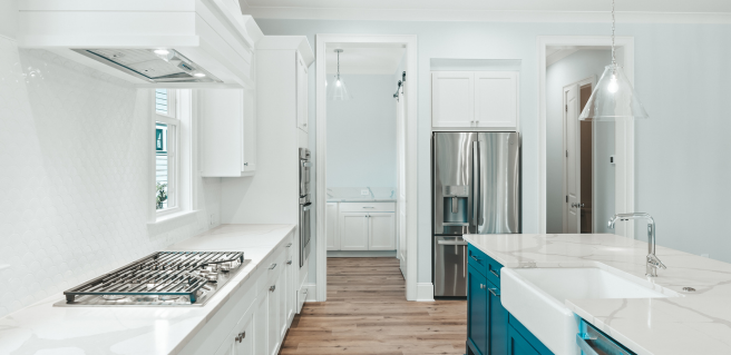 luxury kitchen with white countertops and cabinetry