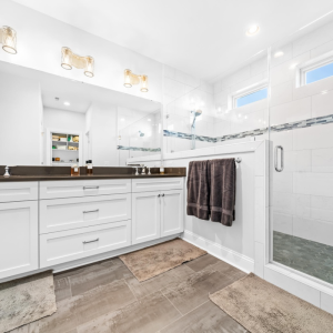 custom owners bathroom at Carolina Beach with white cabinetry