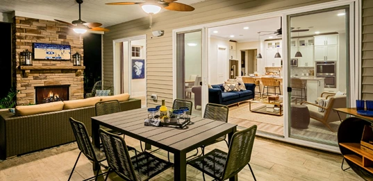 Porch with dining seating is perfect for family dinners al fresco